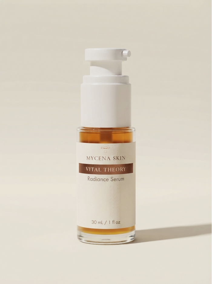 Vital Theory in a white airless pump bottle, amber serum visible through the clear base
