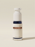 Copper Theory in a white airless pump bottle, navy-blue serum visible through the clear base