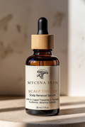 Scalp Theory tonic — Mycena Skin amber glass dropper bottle with bamboo cap on travertine